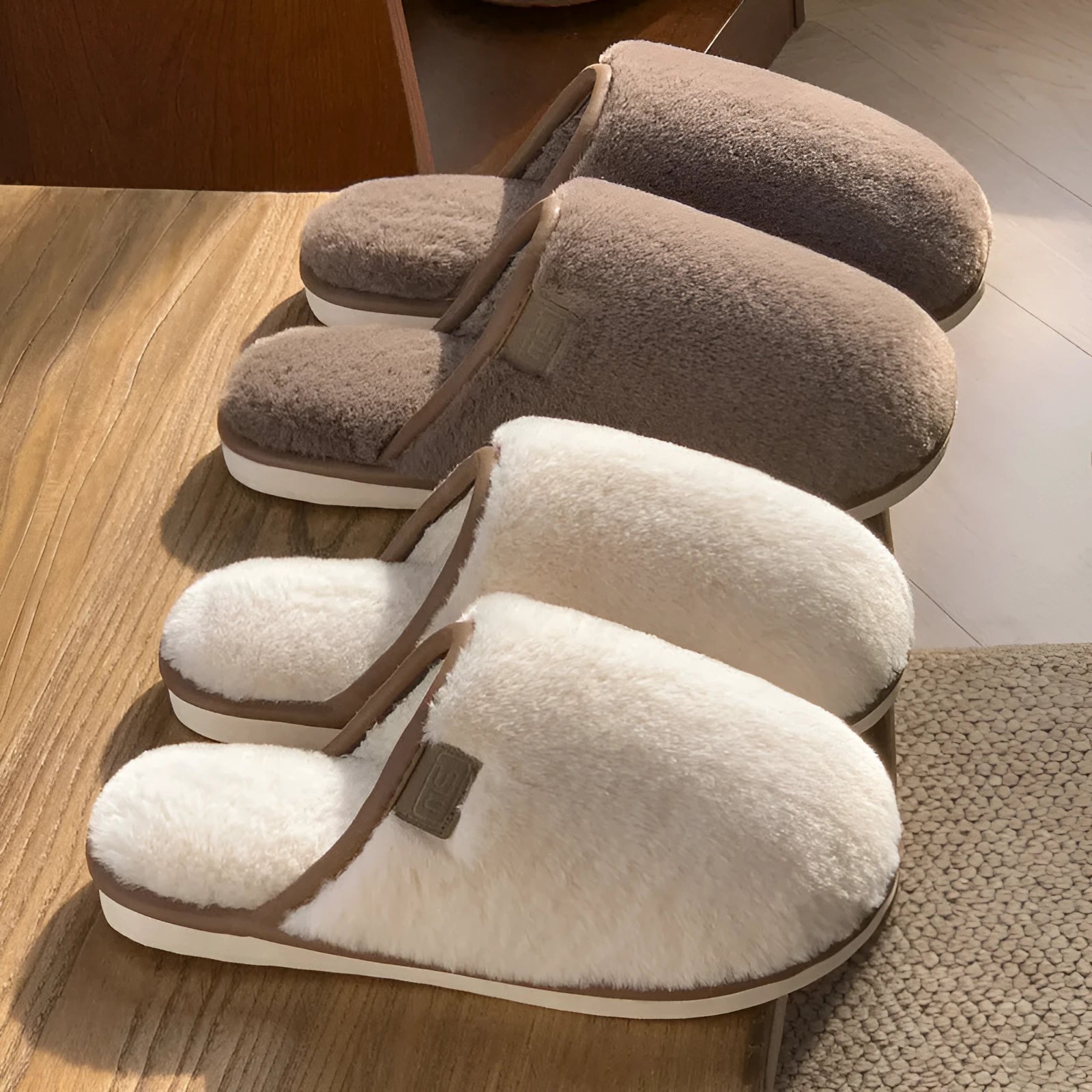 Solid colour PVC plush slippers with non-slip sole and car stitching detail on a wooden floor.