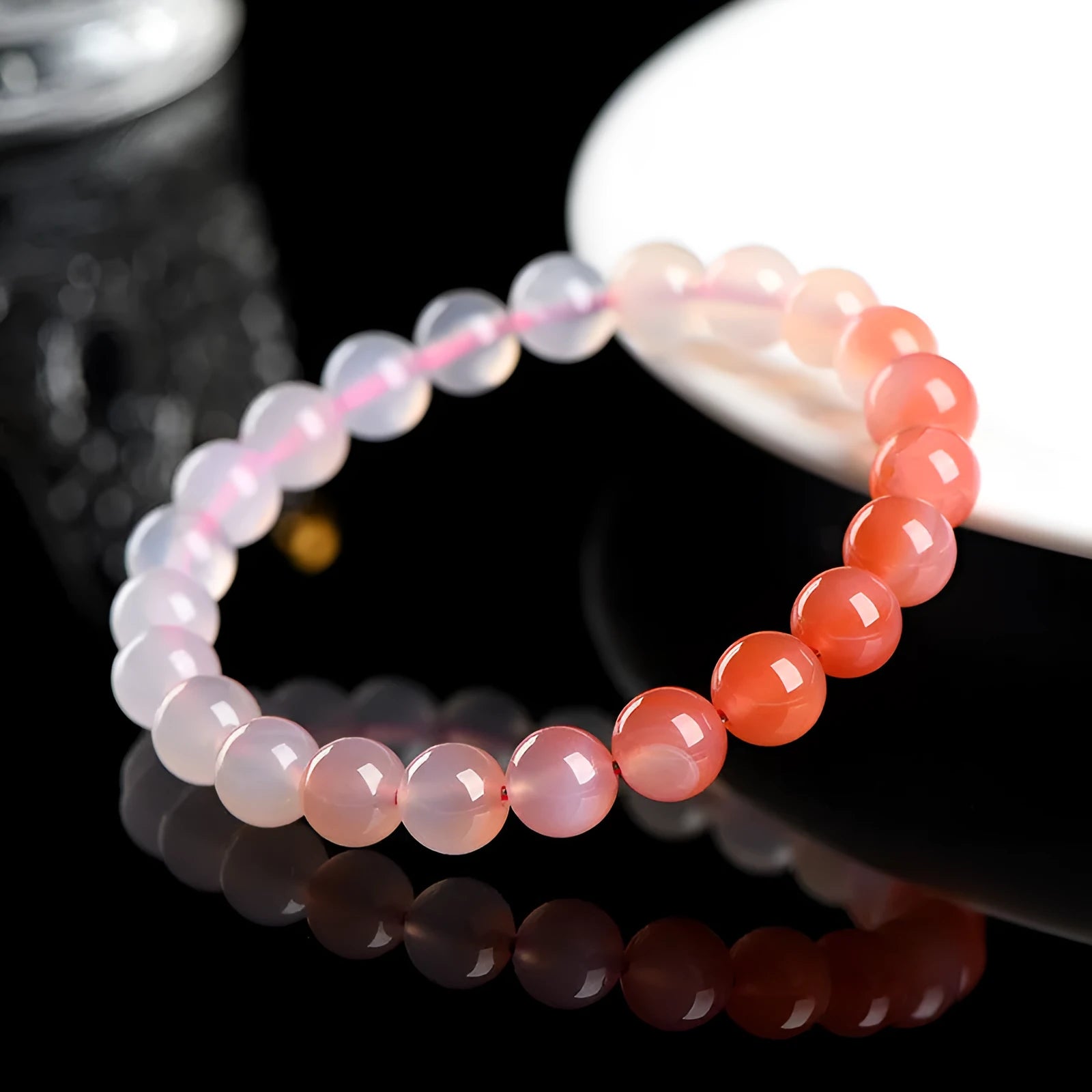 Natural gradient Yanyuan agate stone bracelet showing geometric beads in salt source colour, with size options.