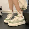 Green women's casual shoes with PU mesh upper, flat heel, and round toe design