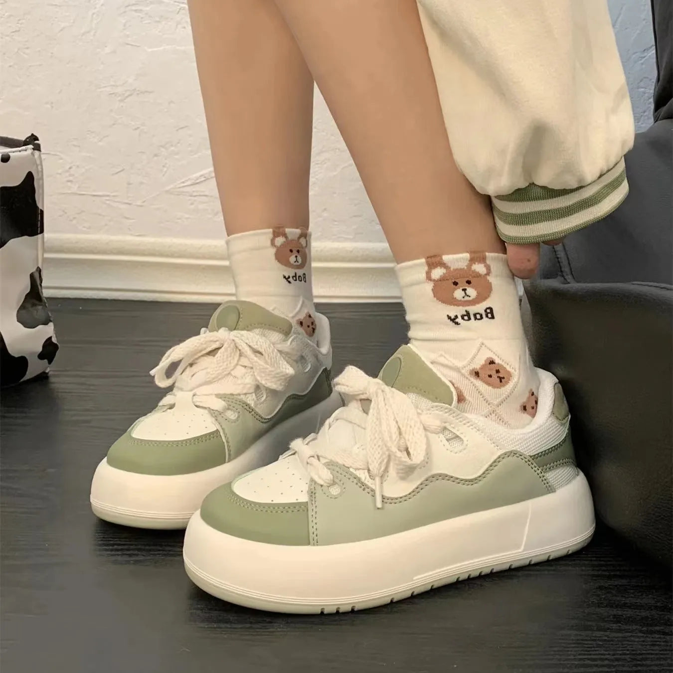 Green women's casual shoes with PU mesh upper, flat heel, and round toe design
