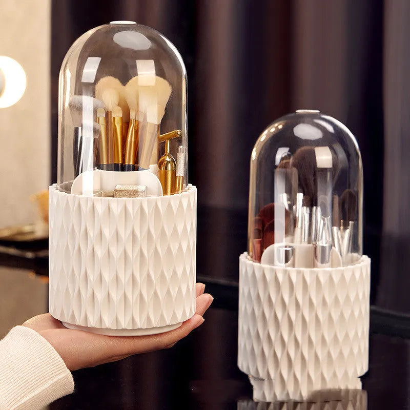 White acrylic rotating makeup brush holder with transparent dust cover on desktop