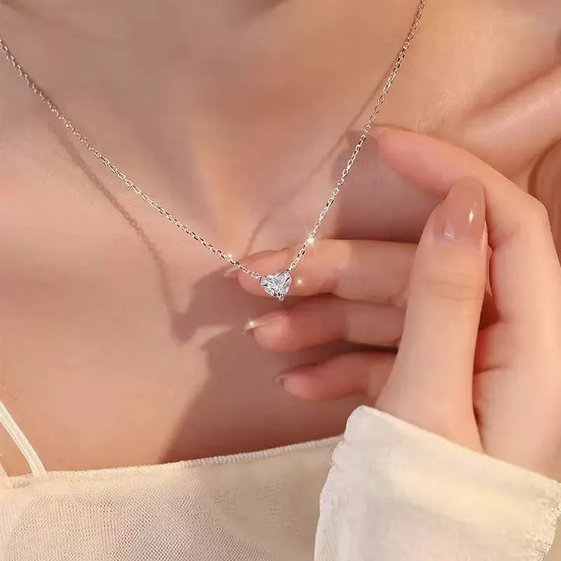 Women's silver heart necklace with copper construction and simple pendant design