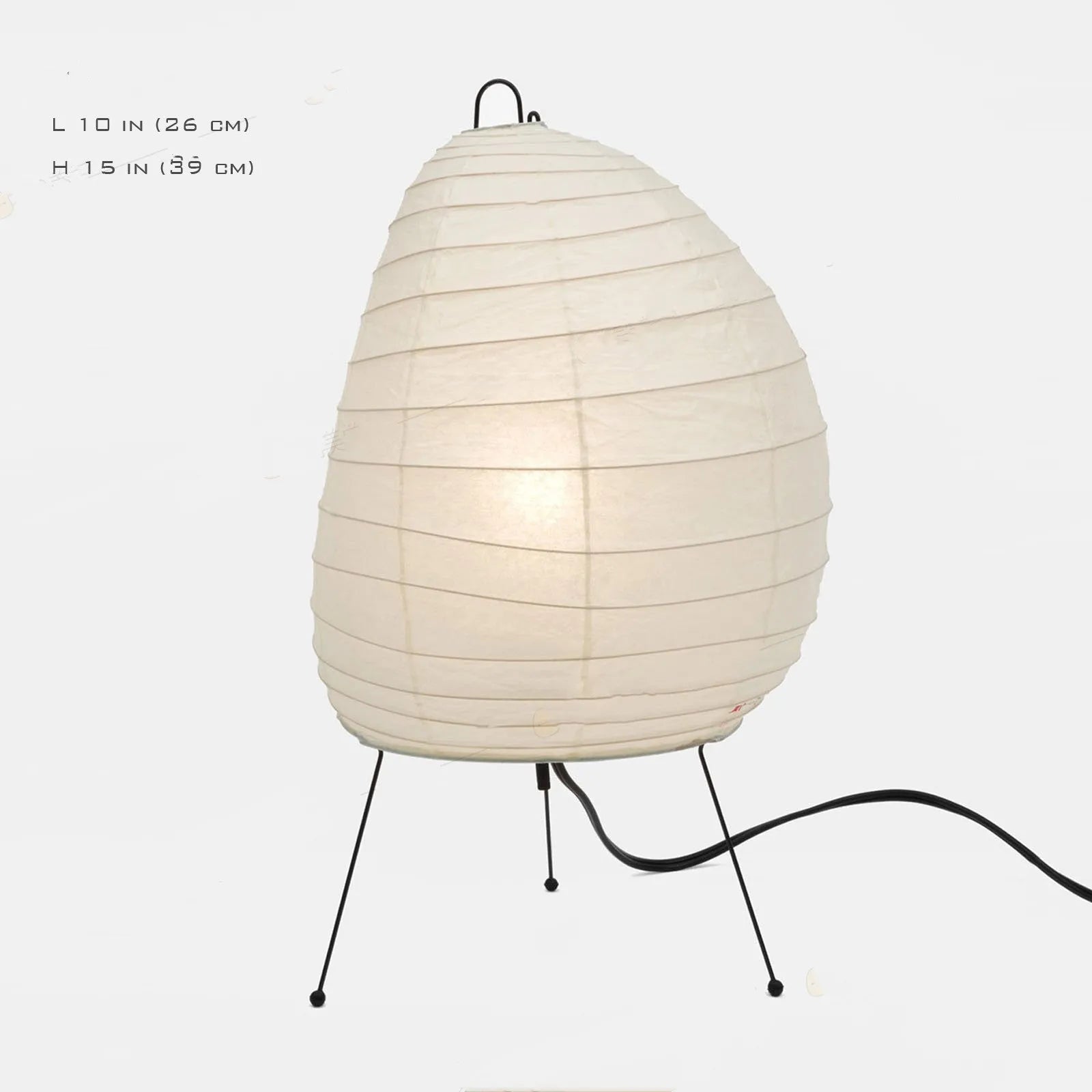 Japanese style handmade rice paper lantern table lamp with aluminium base on a wooden table.