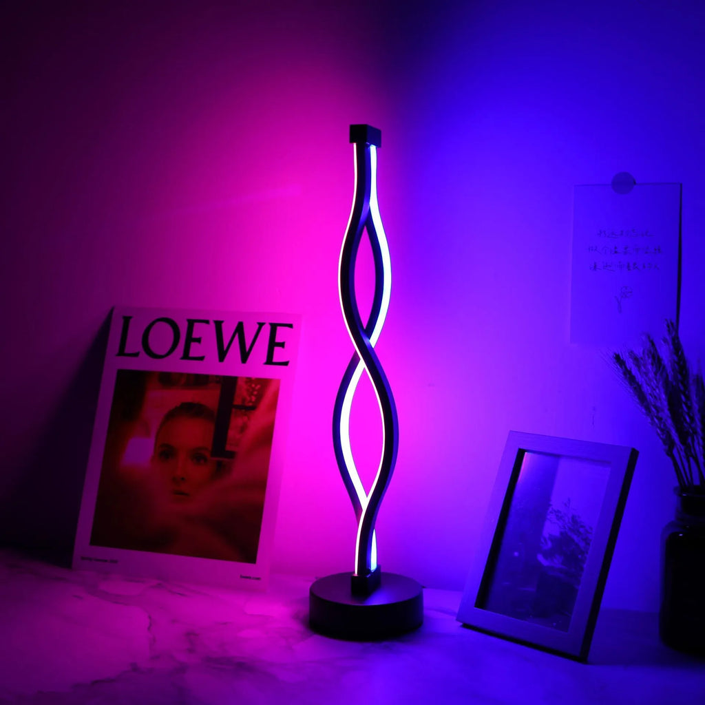 Black aluminium USB desk lamp with three-colour button dimming on a desktop surface