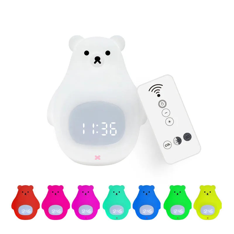 White silicone bear-shaped night light with timer and alarm clock functions on a bedside table.