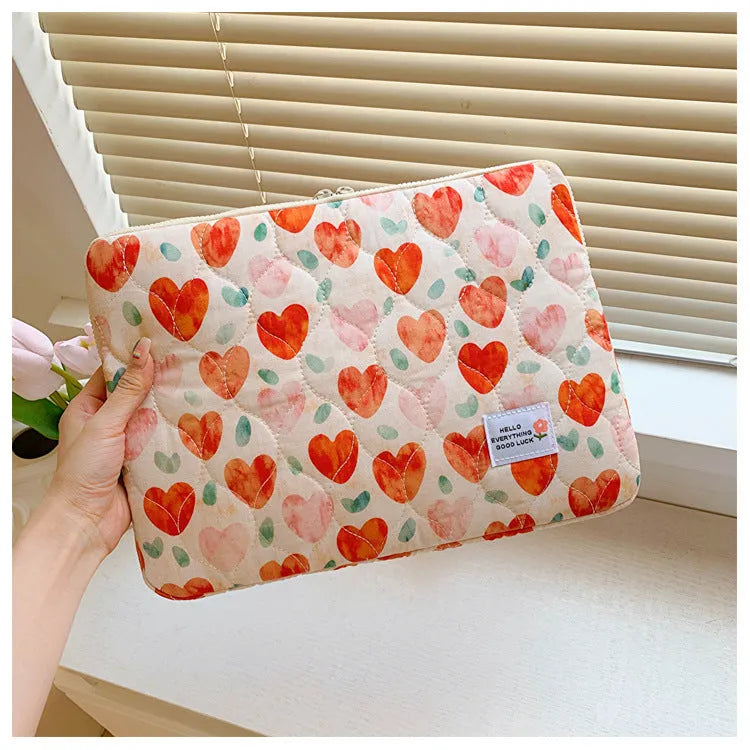 Women's floral print laptop bag in green flower pattern showing storage compartments