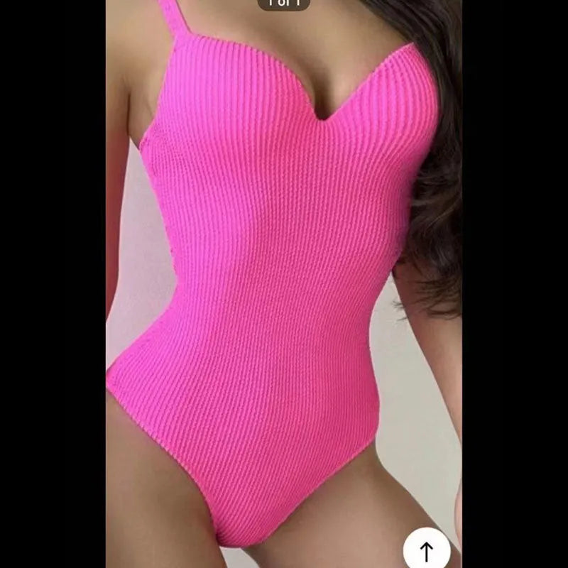 Women's black sunk-stripe one-piece swimsuit made from polyester fabric, sleeveless design.