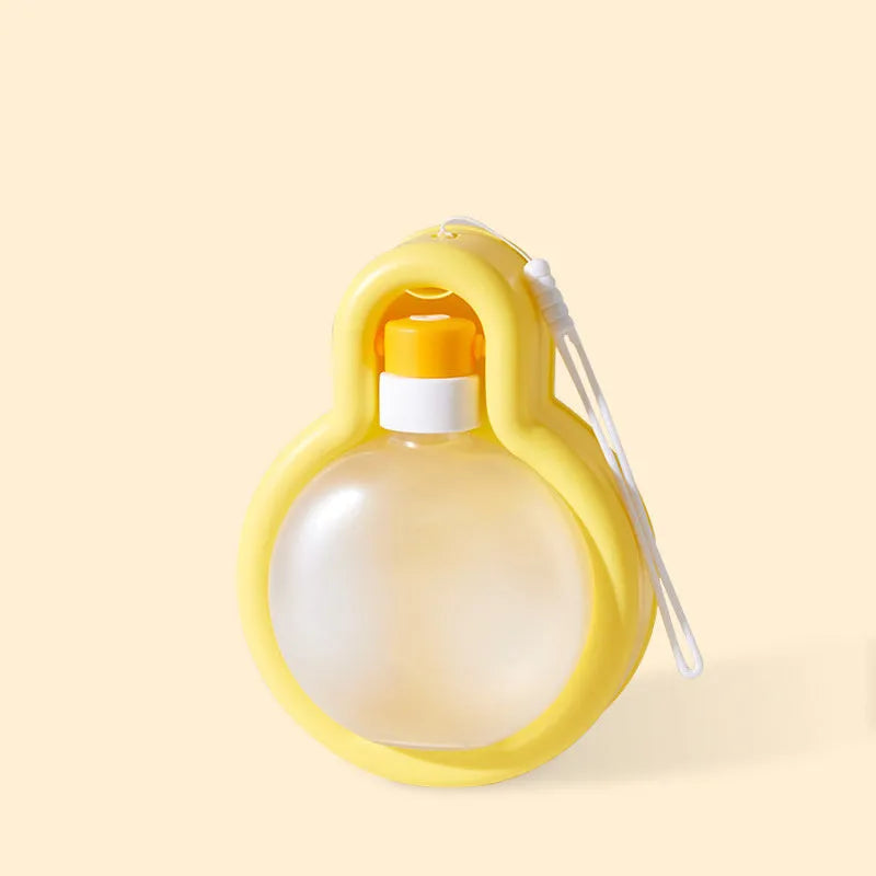 Green portable pet travel water bottle with pull-out drinking bowl for dogs