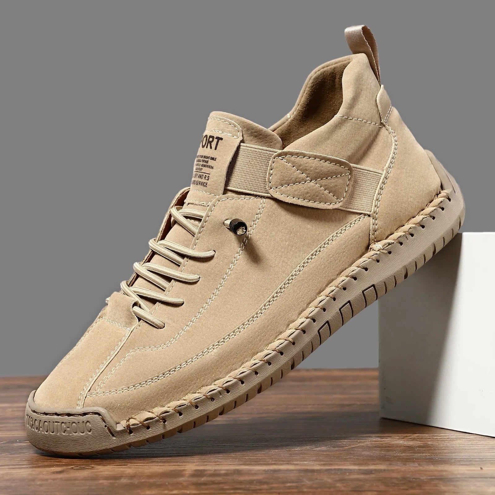 Men's mid-top Martin boot in khaki colour with tooling stitching on the rubber sole.