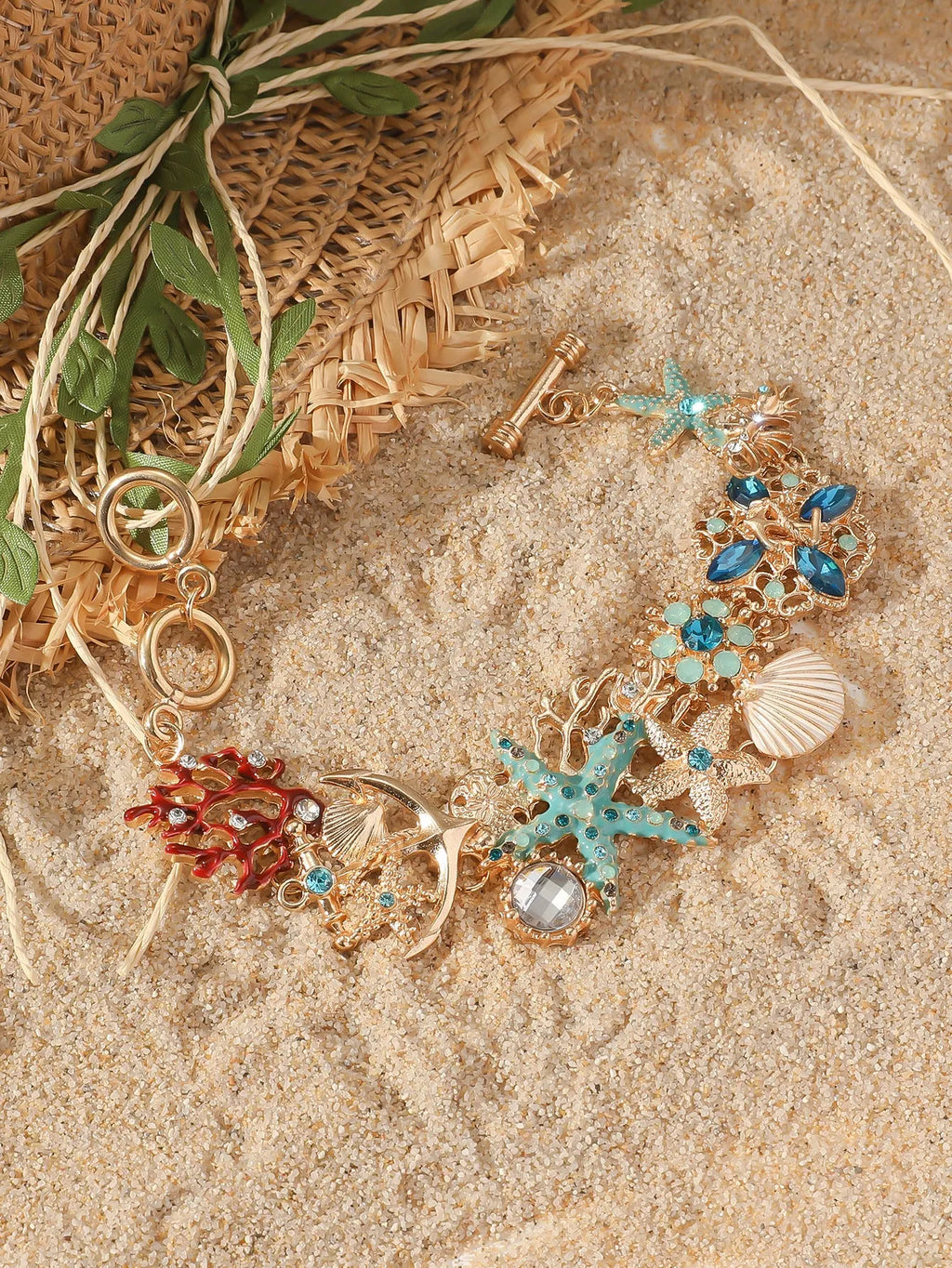 Alloy marine shell boat anchor rhinestone bracelet with starfish details in turquoise colour.