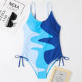 Women's sleeveless backless one-piece swimsuit in blue, shown in a solid colour style.