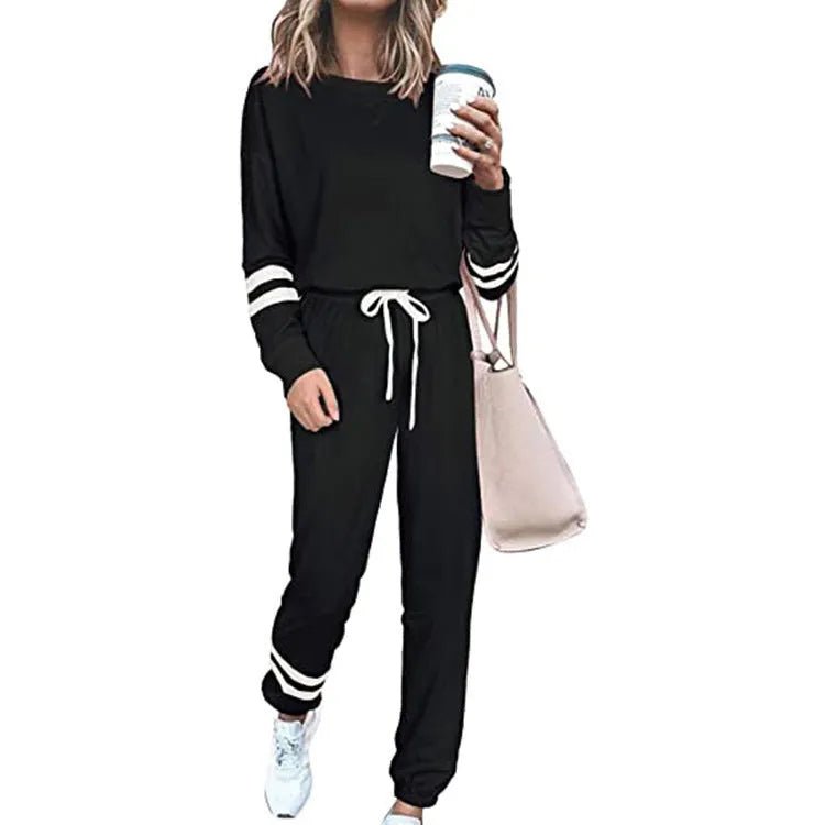 Women's plus size casual suit set in loose-fitting design with half-sleeve top and solid colour trousers