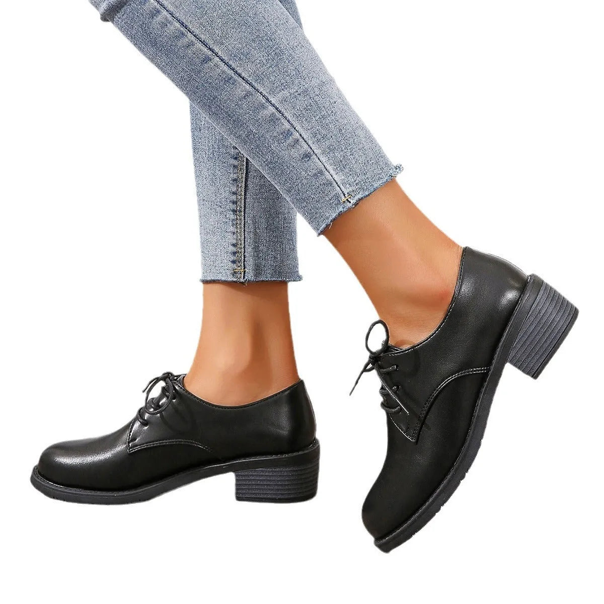 Black women's low-top work shoes with a chunky mid-heel and rounded toe.