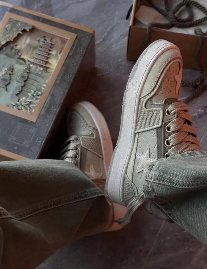 Green casual shoes with star pattern stitching, mesh lining, and thick rubber soles