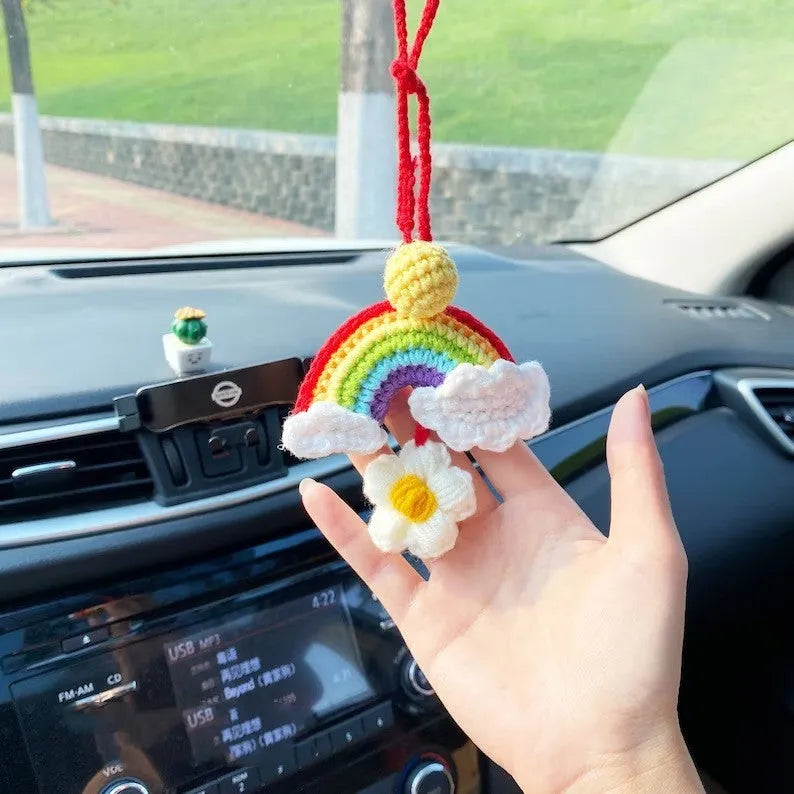 Handmade crocheted wool car pendant with rainbow colours hanging from car mirror