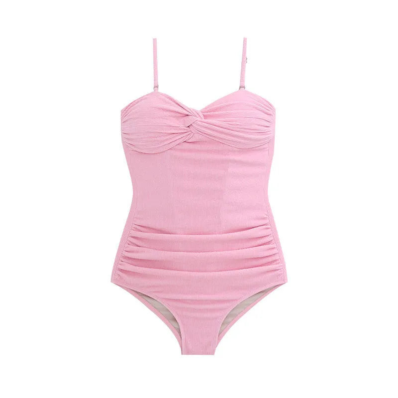 Women's black high-waist one-piece swimsuit with adjustable shoulder straps on a mannequin.