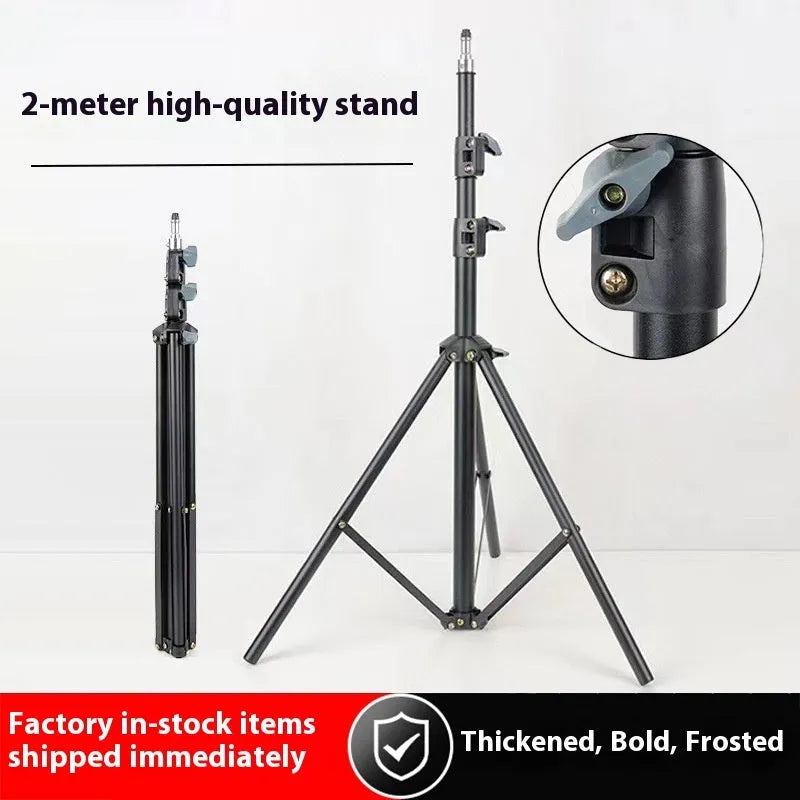 Frosted finish tripod stand with mobile phone holder attached, showing height adjustment mechanism