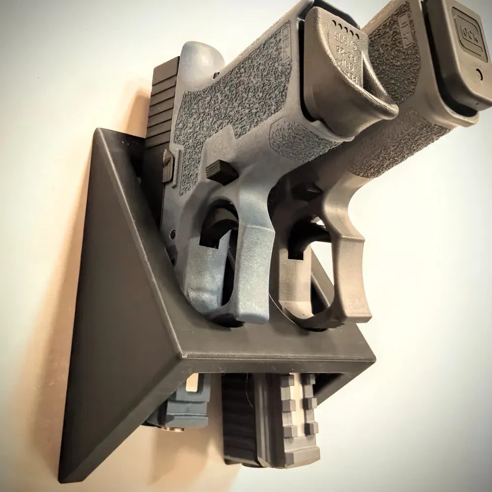 Black plastic punk-style pistol display stand for airsoft guns