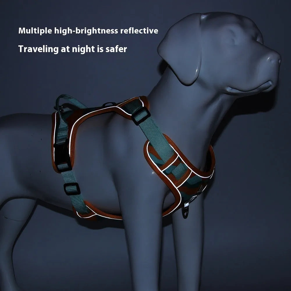 Orange reflective dog chest and back harness with an attached hand-holding rope on a grey background.