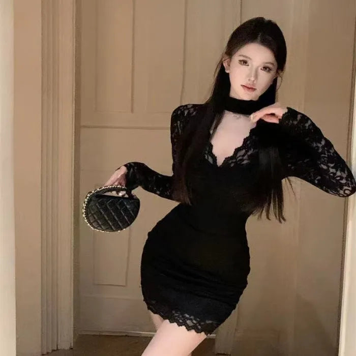 Women's black halter lace dress with floral pattern and integrated hip-wrapped inner skirt on mannequin