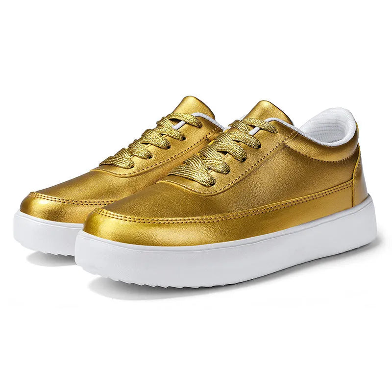 Women's white leather lace-up casual flat trainers on a plain background.