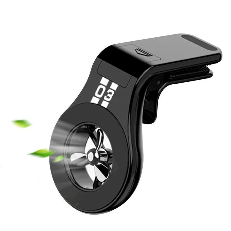 Magnetic car air vent phone holder with perfume dispenser in black, showing phone attached and fragrance slot.