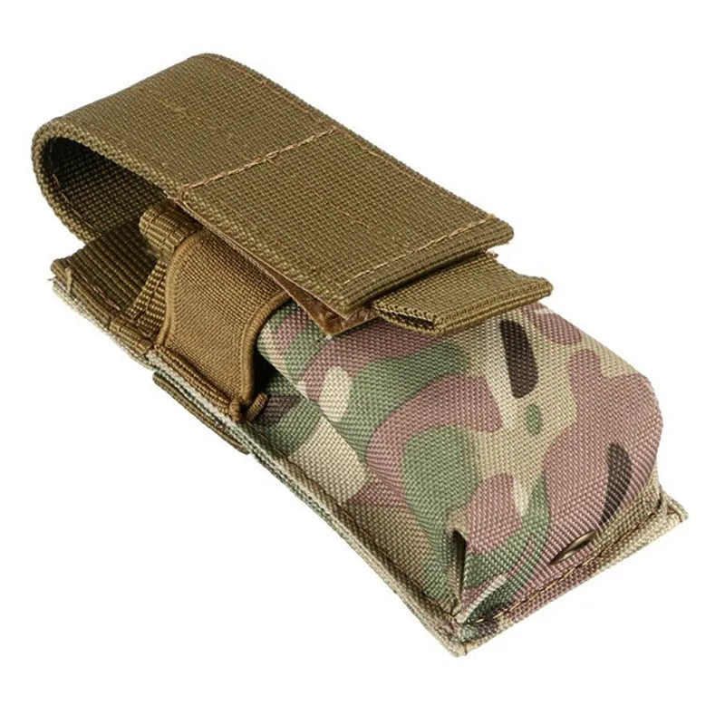 Black tactical Molle waist bag with elastic cord closure, shown next to a pistol cartridge for scale.