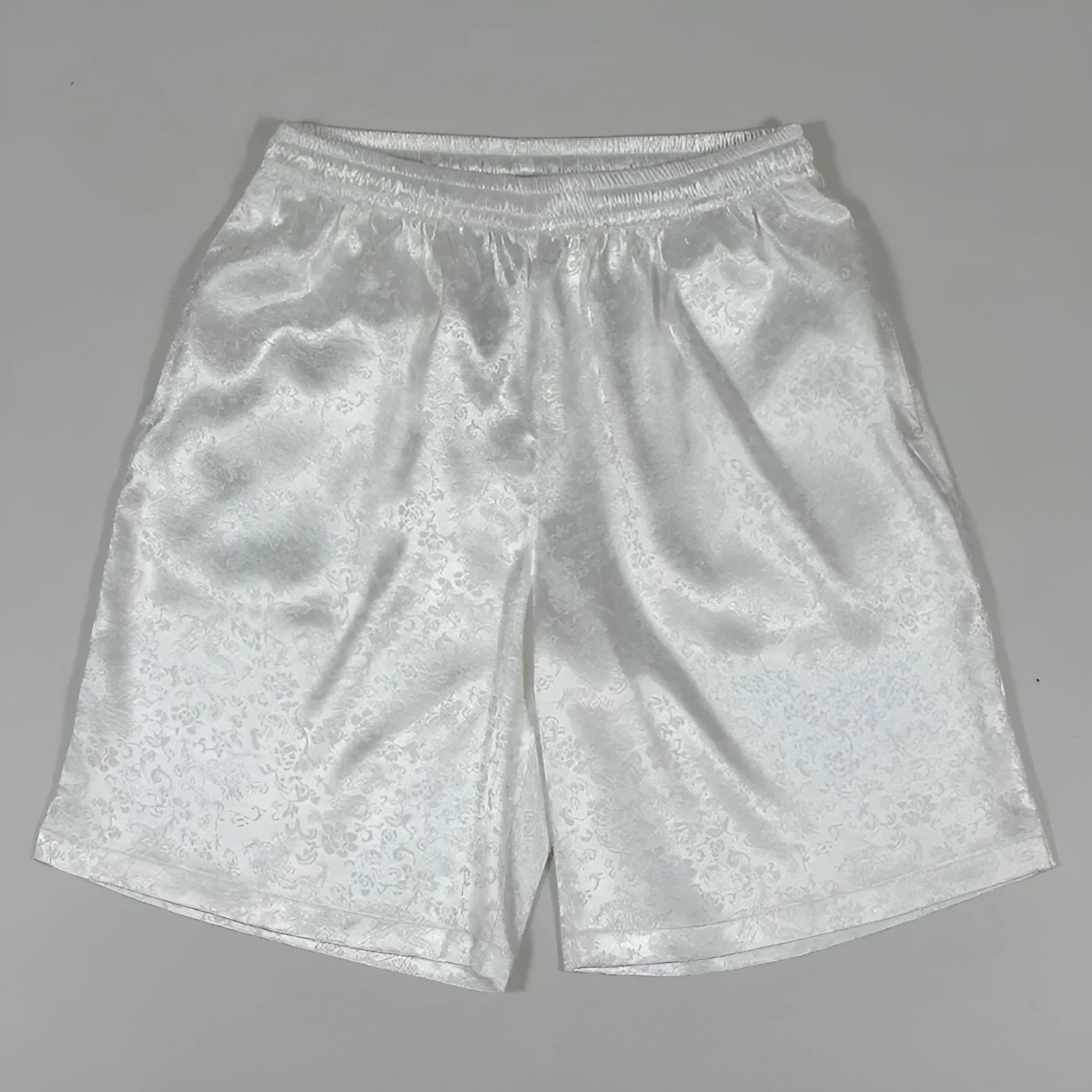 Men's black elastic drawstring Tai Chi shorts made from lightweight polyester fabric.