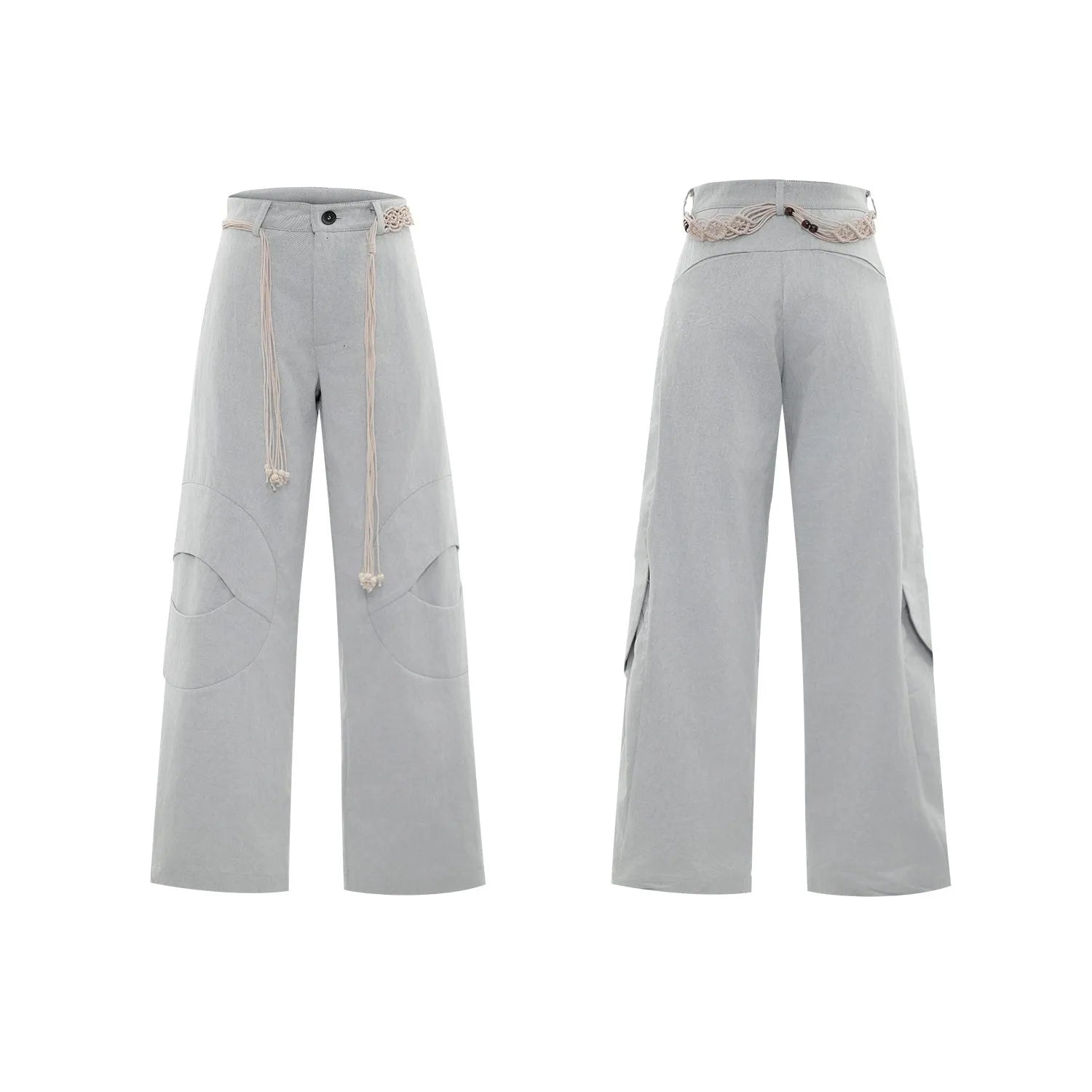 Man wearing dark blue straight-leg cotton jeans with heavy waistband stitching and decorative pocket details
