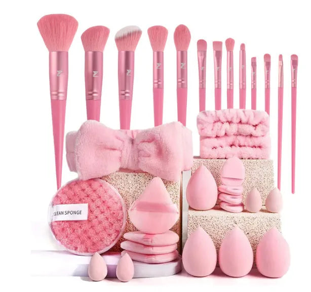 Beauty tool combination set with multiple pieces in pink, brown and purple colours for face wash and makeup application