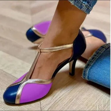 Women's round toe high heel shoe with button fastening in light blue and pink colour combination.