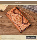 Women's brown genuine leather tri-fold wallet with embossed floral pattern showing open compartments