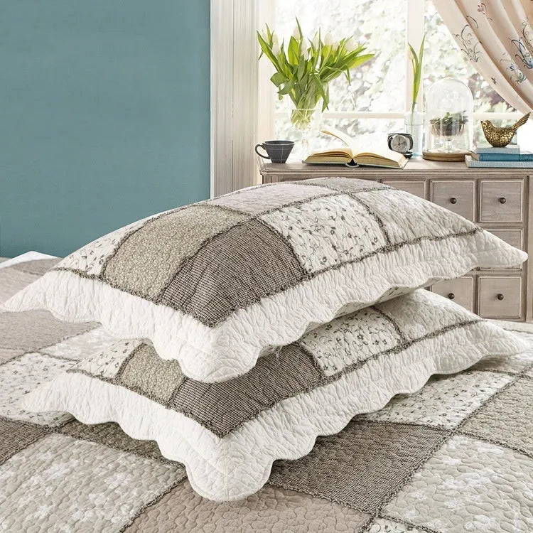 Pure cotton quilted bedspread and pillowcase set in a chosen pattern, laid flat on a bed.
