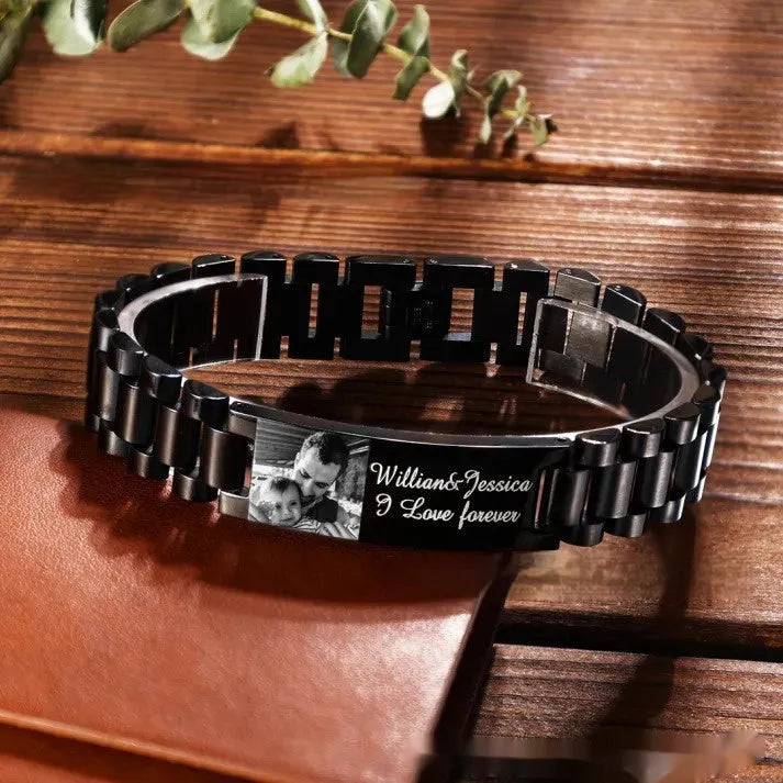 Men's stainless steel heart-shaped bracelet with engraved lettering options on wrist