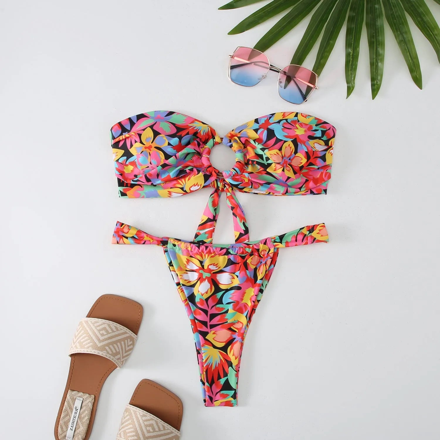 Women's floral print tube top ring bikini swimsuit set on mannequin