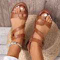Women's flat sandals with Velcro strap in black, brown, and colourful on a rubber sole.