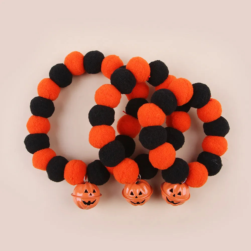 Orange and black Halloween pumpkin pet collar with jingle bell and buckle fastener for cats and dogs