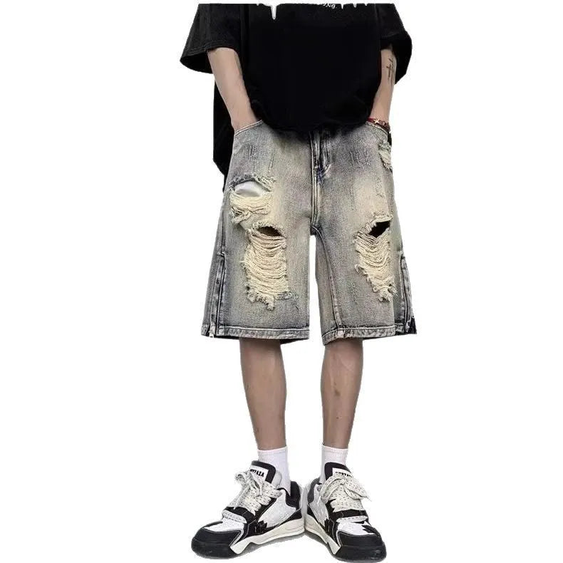 Blue denim shorts with wide leg cut and tattered retro detailing