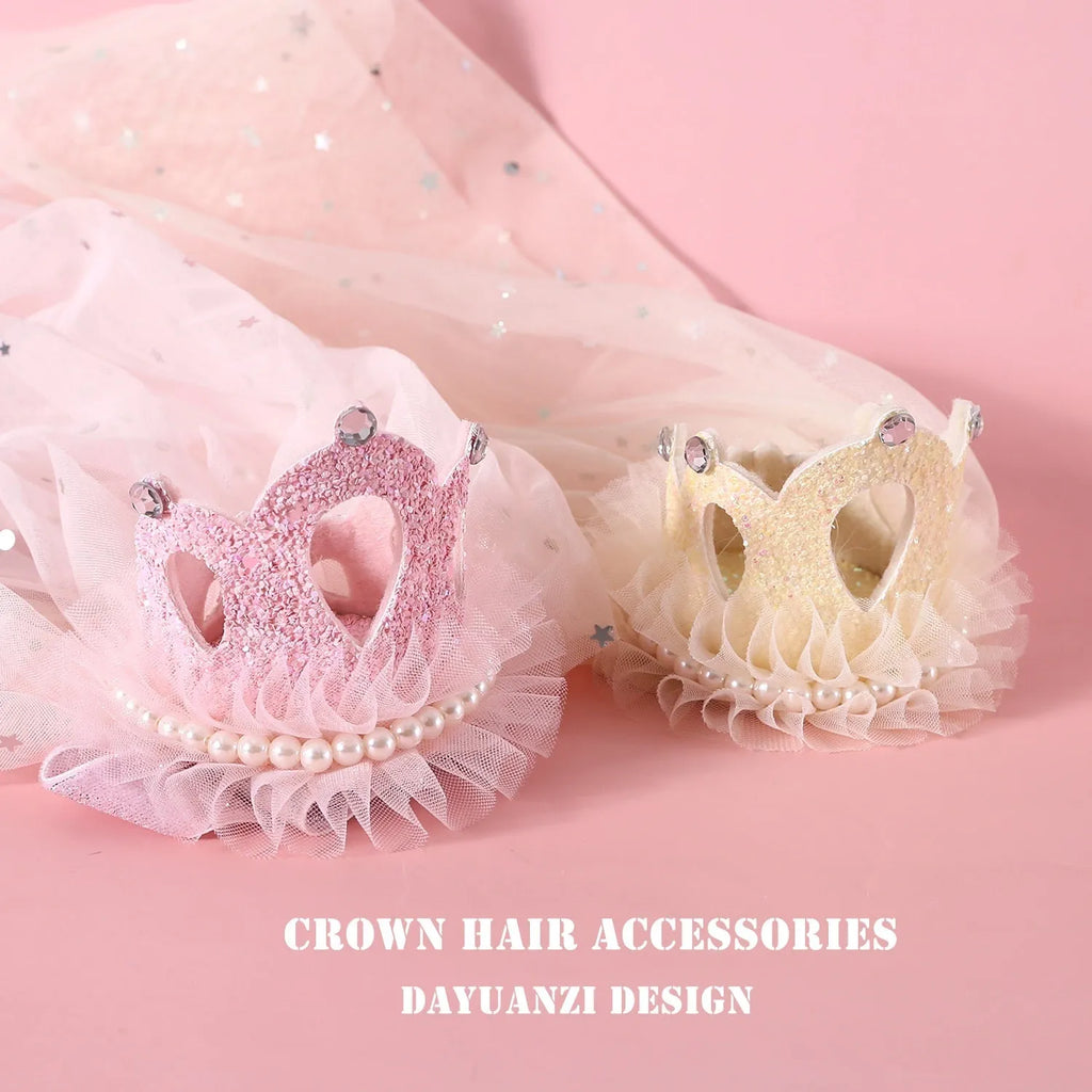 Pet cat wearing a princess crown headdress with a soft pink veil on a fabric headband.
