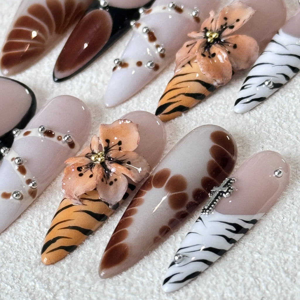 Handmade leopard print false nail stickers with cross and flower designs in sizes XS S M L