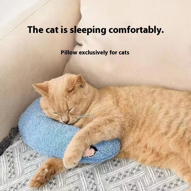 Blue question mark shaped cloth pillow for cat neck support on a pet sleeping mat