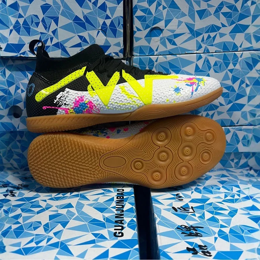 Low-top soccer shoes with broken spike nails on non-slip rubber outsole in black and yellow colourway