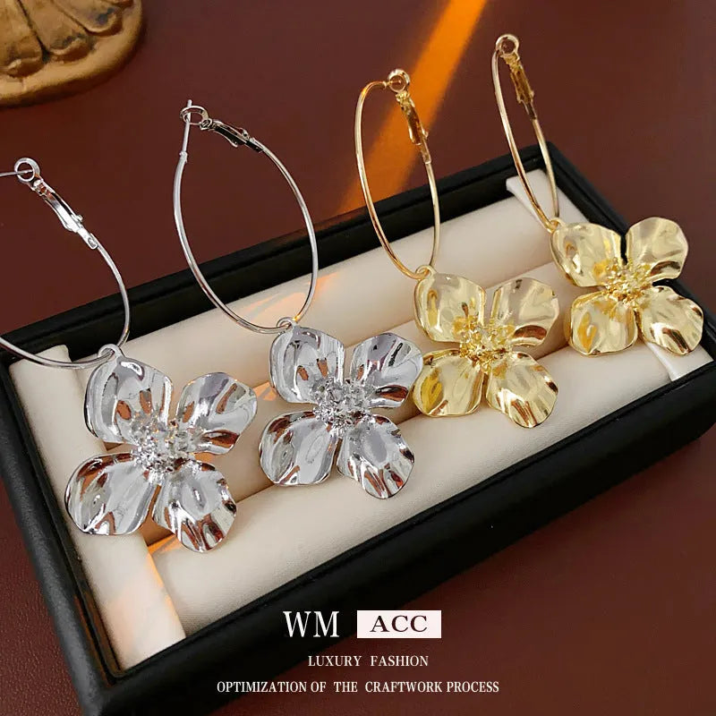 Metal flower geometric earrings with silver needle detail in gold or silver electroplated finish