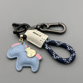 Handmade brown cowhide leather car key ring pendant with a zinc alloy belt buckle and green flanelle rope.