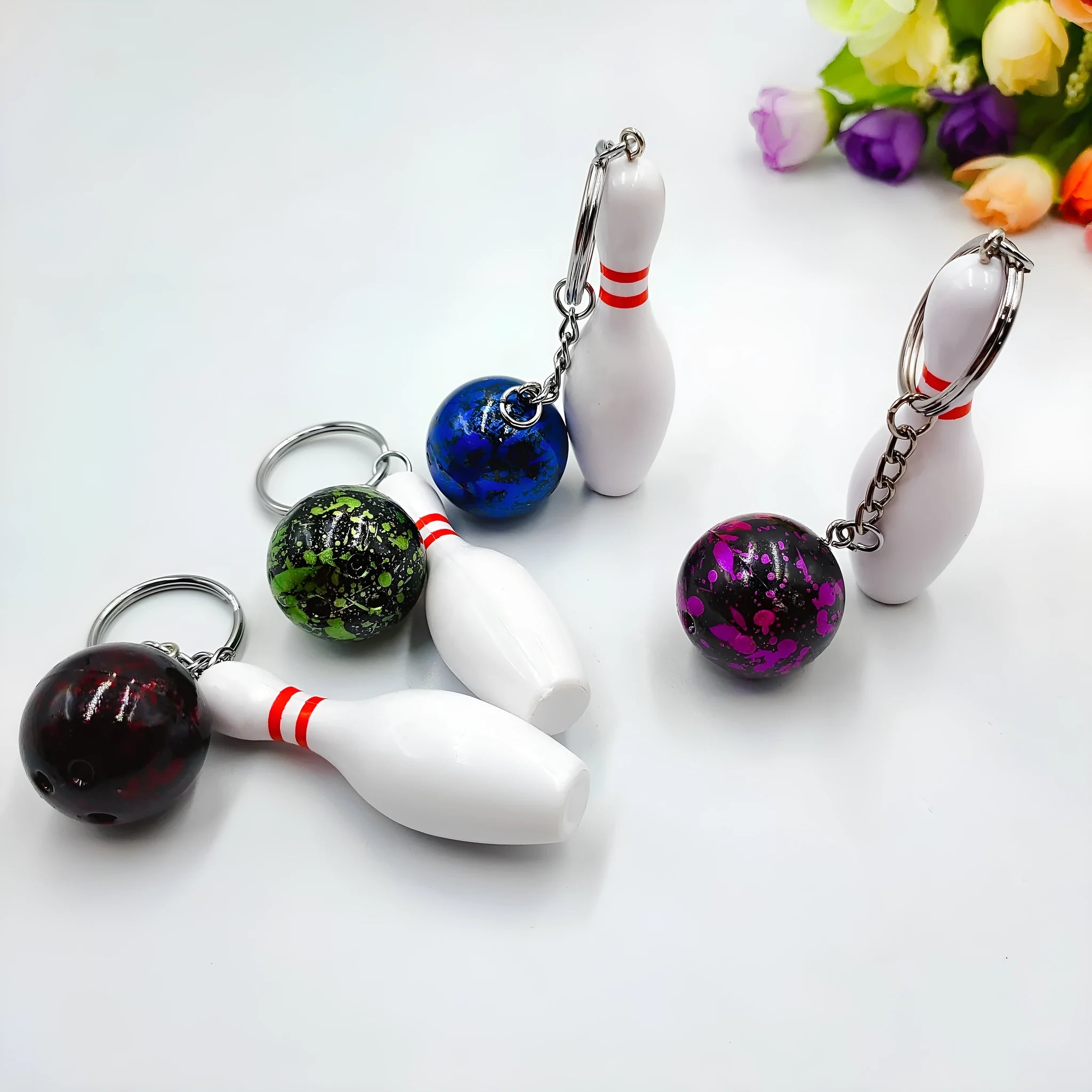 Mini simulation sports bowling keychain pendant in PVC metal on a key ring.