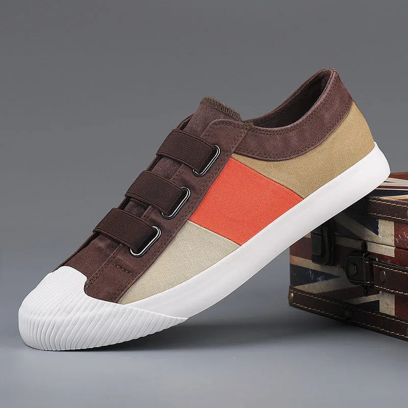 Men's beige canvas low-top sneakers with elastic band closure and a flat rubber sole
