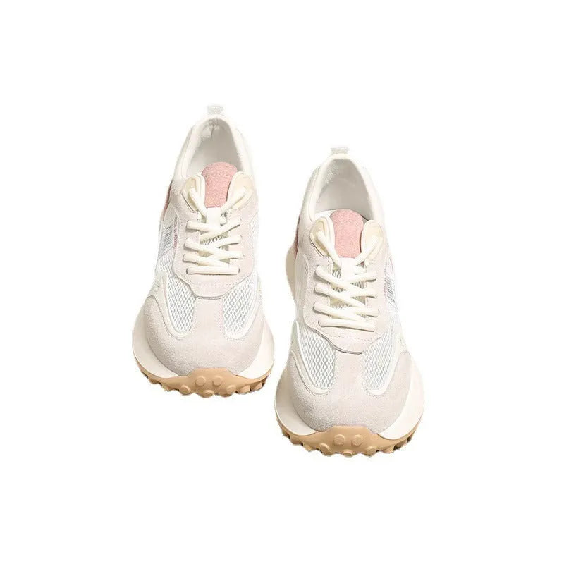 Women's grey retro sneaker with low-top design, mesh lining, and rubber sole