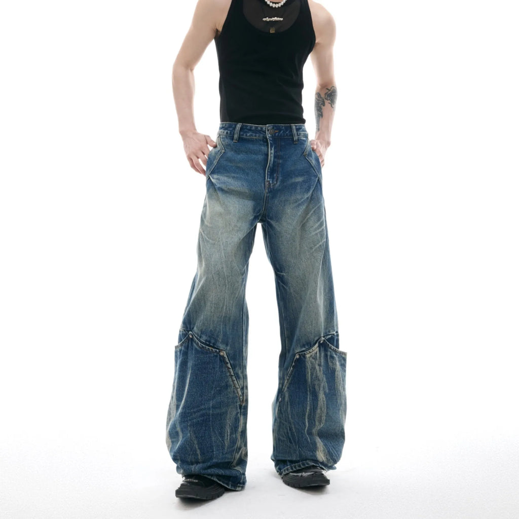 Men's verdant blue loose-fit jeans with a retro washed burst pattern and curved knife leg detail.