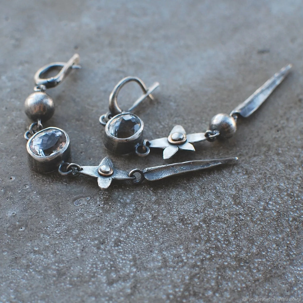 Hesheng geometric long pendant earrings with XINGX design and rhinestones in antique silver.