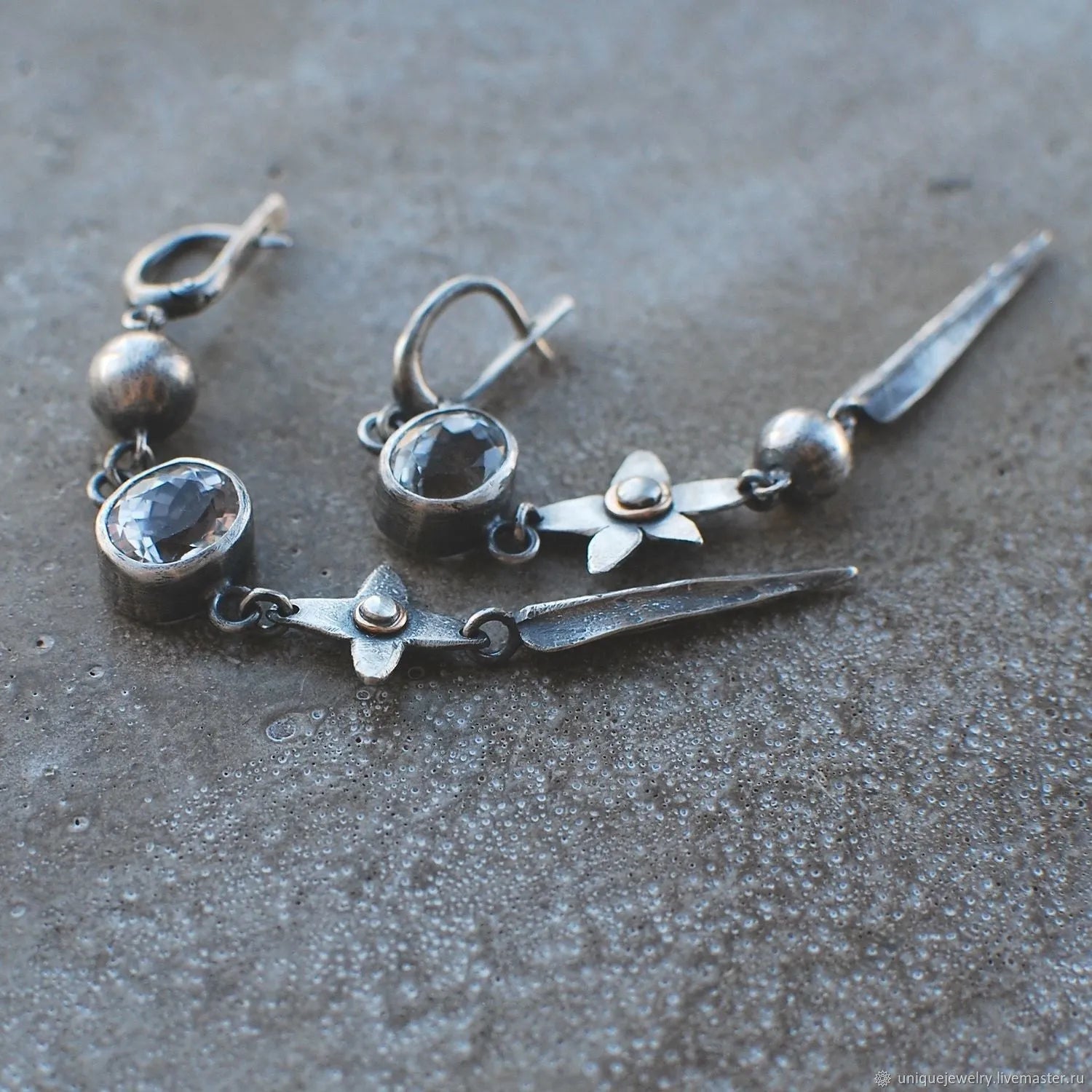 Hesheng geometric long pendant earrings with XINGX design and rhinestones in antique silver.